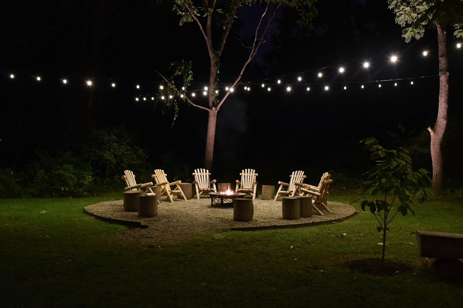 Outdoor seating area with festive lighting